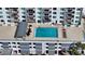 Rooftop pool with lounge chairs, dining tables and a covered area in a condo complex at 101 S Gulfstream Ave # 5J, Sarasota, FL 34236