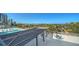 Expansive rooftop deck featuring a pool, lounge chairs, and seating areas with stunning views at 101 S Gulfstream Ave # 5J, Sarasota, FL 34236