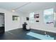 Bright workout room with natural light, yoga mat, exercise ball, and mounted TV at 101 S Gulfstream Ave # 5J, Sarasota, FL 34236