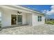 A covered patio with ceiling fan extends living space outdoors at 10105 Canaveral Cir, Sarasota, FL 34241