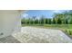 A spacious paved patio offers ample space for outdoor activities and enjoying the serene surroundings at 10105 Canaveral Cir, Sarasota, FL 34241