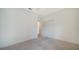 Simple bedroom with neutral carpeting, base molding, and a double door closet at 10105 Canaveral Cir, Sarasota, FL 34241