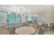 The open clubhouse features a stylish kitchen, ample seating, and a view into another seating area at 10105 Canaveral Cir, Sarasota, FL 34241