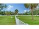 The dog park has a spacious fenced green area offering ample space for recreation at 10105 Canaveral Cir, Sarasota, FL 34241