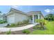 Charming single-Gathering home boasting a well-manicured lawn and a cozy front porch perfect for enjoying the outdoors at 10105 Canaveral Cir, Sarasota, FL 34241