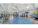 Community gym showcasing workout machines and free weights at 10105 Canaveral Cir, Sarasota, FL 34241