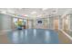 Spacious gym with windows, high ceilings, and fitness equipment at 10105 Canaveral Cir, Sarasota, FL 34241
