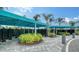 Community mailboxes feature shade covers, lush landscaping, and convenient access for residents at 10105 Canaveral Cir, Sarasota, FL 34241