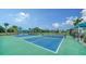 Enjoy a game of tennis on the community tennis courts, perfect for exercise and friendly competition at 10105 Canaveral Cir, Sarasota, FL 34241
