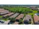 Overhead view of the property in a planned community with lush landscaping and a nearby pond at 10205 Saint Francis Ter, Palmetto, FL 34221