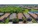 Aerial view showcasing the home's placement among other residences and community landscaping at 10205 Saint Francis Ter, Palmetto, FL 34221