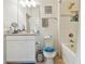Clean and well-maintained bathroom featuring a vanity, toilet, and shower-tub combination at 10205 Saint Francis Ter, Palmetto, FL 34221