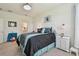 Well-lit bedroom featuring neutral walls, a decorated bed, and an ensuite bathroom at 10205 Saint Francis Ter, Palmetto, FL 34221