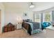 Comfortable bedroom with bed, wooden chest and dresser at 10205 Saint Francis Ter, Palmetto, FL 34221