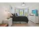 Bright bedroom with dresser, and bay windows with custom blinds at 10205 Saint Francis Ter, Palmetto, FL 34221