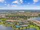 Expansive community amenities including a pool, tennis courts, and scenic landscaping by the lake at 10205 Saint Francis Ter, Palmetto, FL 34221