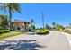 Welcoming community entrance with well-manicured landscaping and decorative stone gatehouse at 10205 Saint Francis Ter, Palmetto, FL 34221