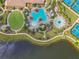Overhead view of the community pool area with decorative pools, seating, and manicured landscaping at 10205 Saint Francis Ter, Palmetto, FL 34221