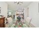Bright dining area showcasing a glass table, modern chairs, and easy access to kitchen at 10205 Saint Francis Ter, Palmetto, FL 34221