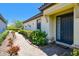 Home features a welcoming entrance with a walkway, lush landscaping and classic architectural details at 10205 Saint Francis Ter, Palmetto, FL 34221