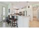 Bright kitchen features white cabinetry, stainless steel appliances, and breakfast bar seating at 10205 Saint Francis Ter, Palmetto, FL 34221