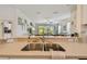 Open kitchen featuring a dual sink, breakfast bar, and a view into the living room at 10205 Saint Francis Ter, Palmetto, FL 34221