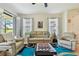 Relax in this living room featuring cozy seating arrangements and natural light, perfect for gatherings at 10205 Saint Francis Ter, Palmetto, FL 34221