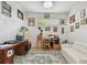 Cozy home office featuring a wooden desk, natural light, and decorative wall art at 10205 Saint Francis Ter, Palmetto, FL 34221