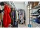 Well-organized walk-in closet with shelving and hanging space, conveniently located near the bathroom at 10205 Saint Francis Ter, Palmetto, FL 34221