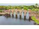 Picturesque stone water feature with archways and fountains in a lush community setting at 10205 Saint Francis Ter, Palmetto, FL 34221