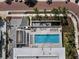 Rooftop pool and lounge area with ample seating, offering a perfect spot for relaxation and recreation at 111 Golden Gate Pt # 802Ph, Sarasota, FL 34236
