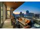 Stunning balcony with comfortable seating and beautiful ocean views at sunset at 111 Golden Gate Pt # 802Ph, Sarasota, FL 34236