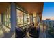 Spacious balcony with outdoor furniture and sliding glass doors to the living area at 111 Golden Gate Pt # 802Ph, Sarasota, FL 34236