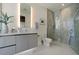 Modern bathroom features sleek vanity, glass-enclosed shower, and contemporary fixtures for a spa-like experience at 111 Golden Gate Pt # 802Ph, Sarasota, FL 34236