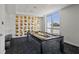 Well-lit billiards room with modern decor, artwork, and ample space for recreation at 111 Golden Gate Pt # 802Ph, Sarasota, FL 34236
