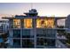 Luxury condo building featuring large windows and terraces offering stunning views of the surrounding cityscape and water at 111 Golden Gate Pt # 802Ph, Sarasota, FL 34236