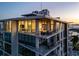 Modern condo building featuring large windows, balconies, and a sleek architectural design at 111 Golden Gate Pt # 802Ph, Sarasota, FL 34236