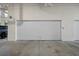 Modern garage door offering secure parking and convenient access to the property at 111 Golden Gate Pt # 802Ph, Sarasota, FL 34236