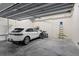 Well-organized garage featuring parking space, bicycle storage, and ample room for your hobbies at 111 Golden Gate Pt # 802Ph, Sarasota, FL 34236