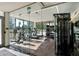Modern gym with glass walls, state-of-the-art equipment, and ample natural light at 111 Golden Gate Pt # 802Ph, Sarasota, FL 34236