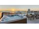 Relaxing rooftop hot tub with stunning water views, perfect for unwinding and enjoying the scenery at 111 Golden Gate Pt # 802Ph, Sarasota, FL 34236