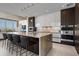 Modern kitchen with a large island, stainless appliances, and beautiful finishes at 111 Golden Gate Pt # 802Ph, Sarasota, FL 34236