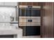 Stainless steel Wolf double oven adding a touch of class to any modern kitchen at 111 Golden Gate Pt # 802Ph, Sarasota, FL 34236