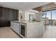 Modern kitchen with island, stainless steel appliances, pendant lighting and open to the dining area at 111 Golden Gate Pt # 802Ph, Sarasota, FL 34236