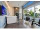 Modern lobby area with high ceilings, ample windows, and comfortable seating, creating a welcoming space at 111 Golden Gate Pt # 802Ph, Sarasota, FL 34236