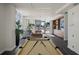 Spacious lounge area with a pool table, comfortable seating, and access to outdoor amenities at 111 Golden Gate Pt # 802Ph, Sarasota, FL 34236