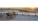 Charming rooftop dining area with scenic water views and a perfect spot for outdoor meals at 111 Golden Gate Pt # 802Ph, Sarasota, FL 34236