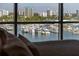 Stunning waterfront view with a marina, visible from the room's large windows at 111 Golden Gate Pt # 802Ph, Sarasota, FL 34236