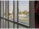 Breathtaking waterfront views featuring boats and city skyline through expansive windows at 111 Golden Gate Pt # 802Ph, Sarasota, FL 34236