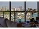 Close up shot through a window of the water view and marina with lots of boats at 111 Golden Gate Pt # 802Ph, Sarasota, FL 34236